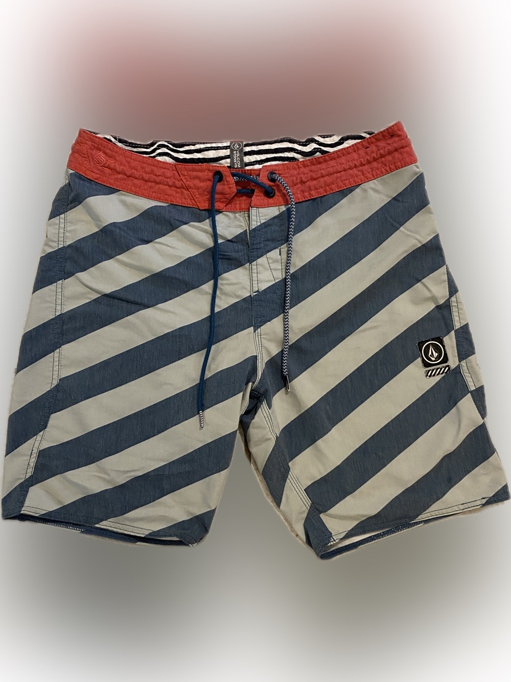 Volcom stoneys board shorts, size 30, color red and blue